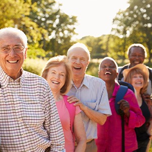 Diverse group of seniors hiking together outside