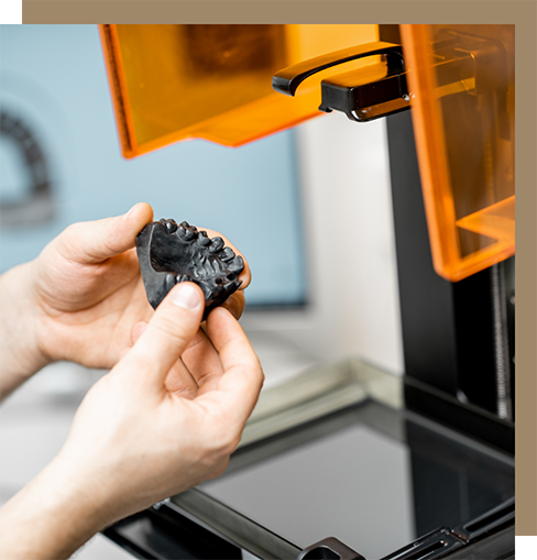3D printer creating a mold of teeth