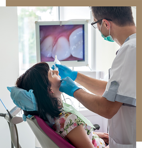 Dentist taking close-up photos of a patient's teeth