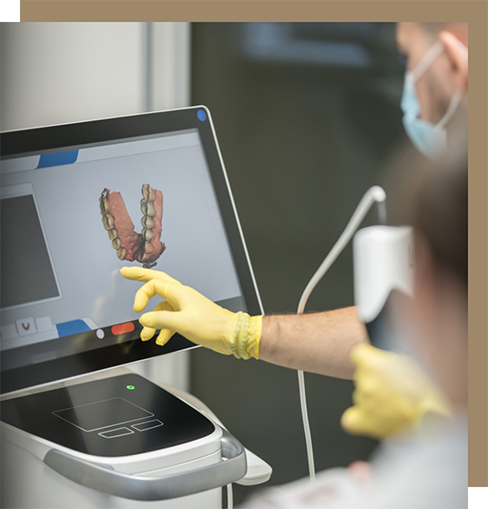 Dentist looking at impressions of a patient's teeth