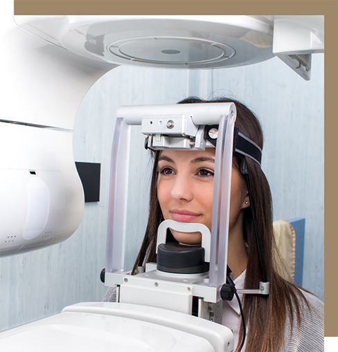 Dental patient getting a CT cone beam scan of her mouth and jaws