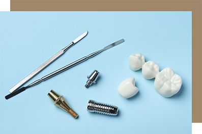 Parts of two dental implants on a table