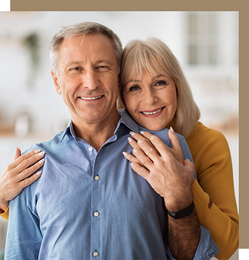 Older couple embracing at home